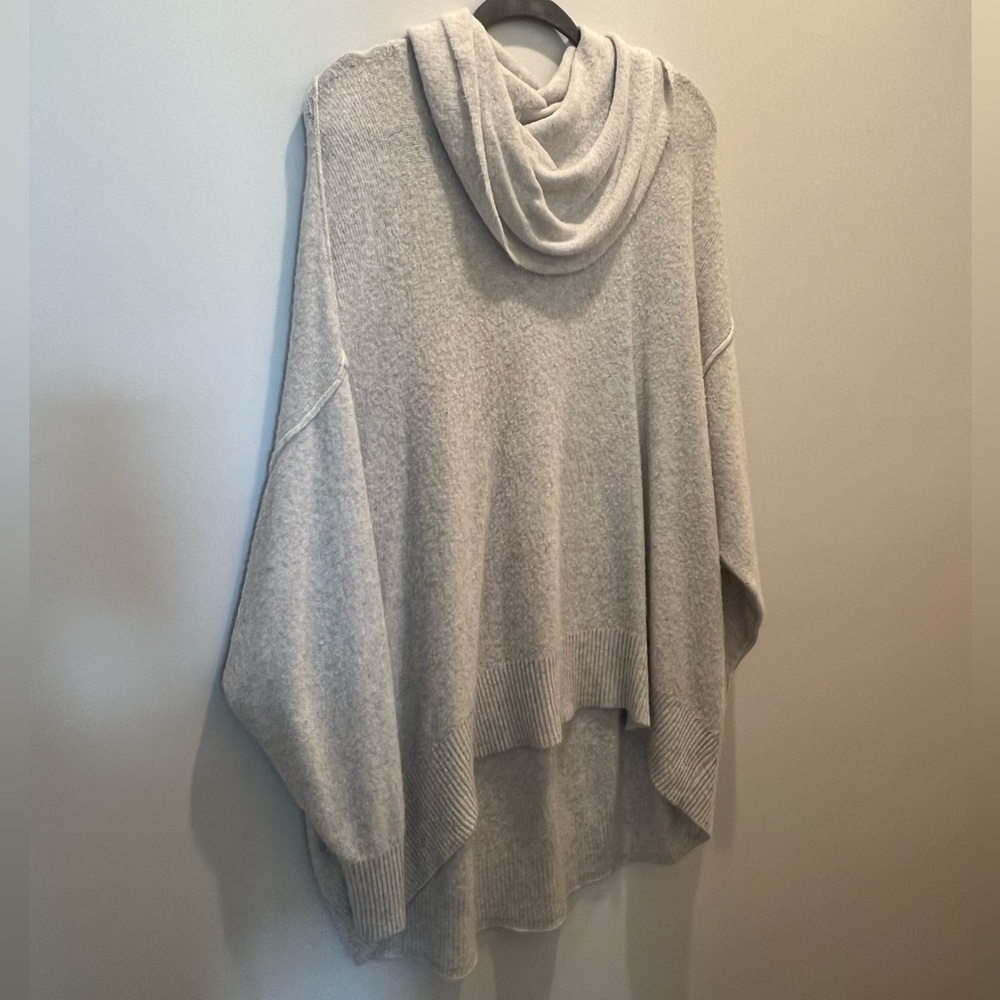 Cream, fuzzy, oversized American Eagle sweater.